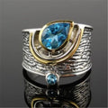 Women's Chinese style drop shape ring with blue rhinestone zircon centrepiece on alloy band