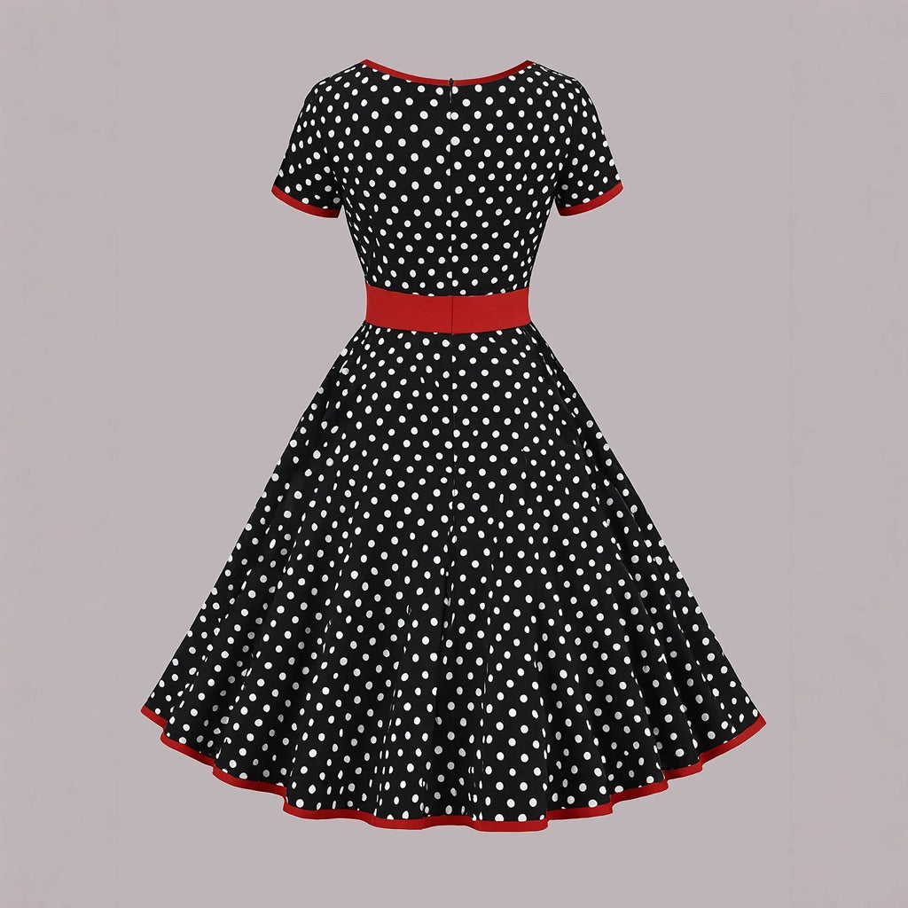 Multicolour polka dot midi dress with a structured square neckline and a front metal zipper closure.