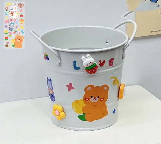 Round metal desktop pen holder storage box in a choice of colours including pink, green, red, white, and yellow.