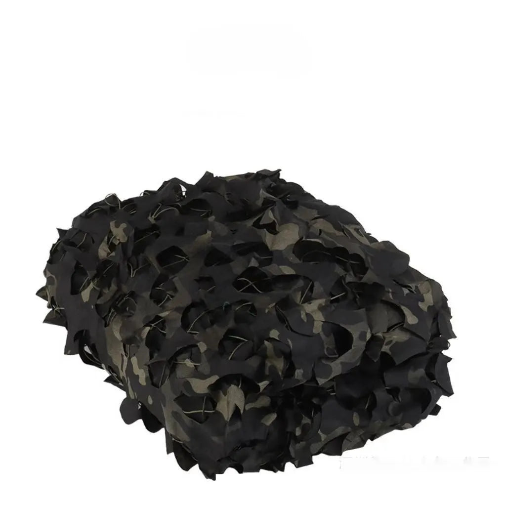 Green camouflage netting cover shown in a desert camouflage pattern, laid over outdoor terrain.