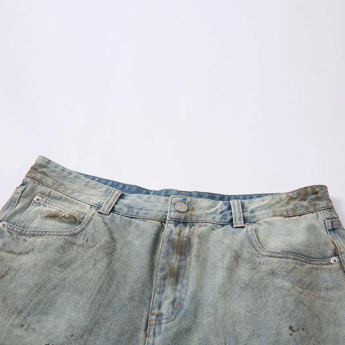 Woman wearing cropped, washed blue straight-leg denim jeans with a mid-rise fit.