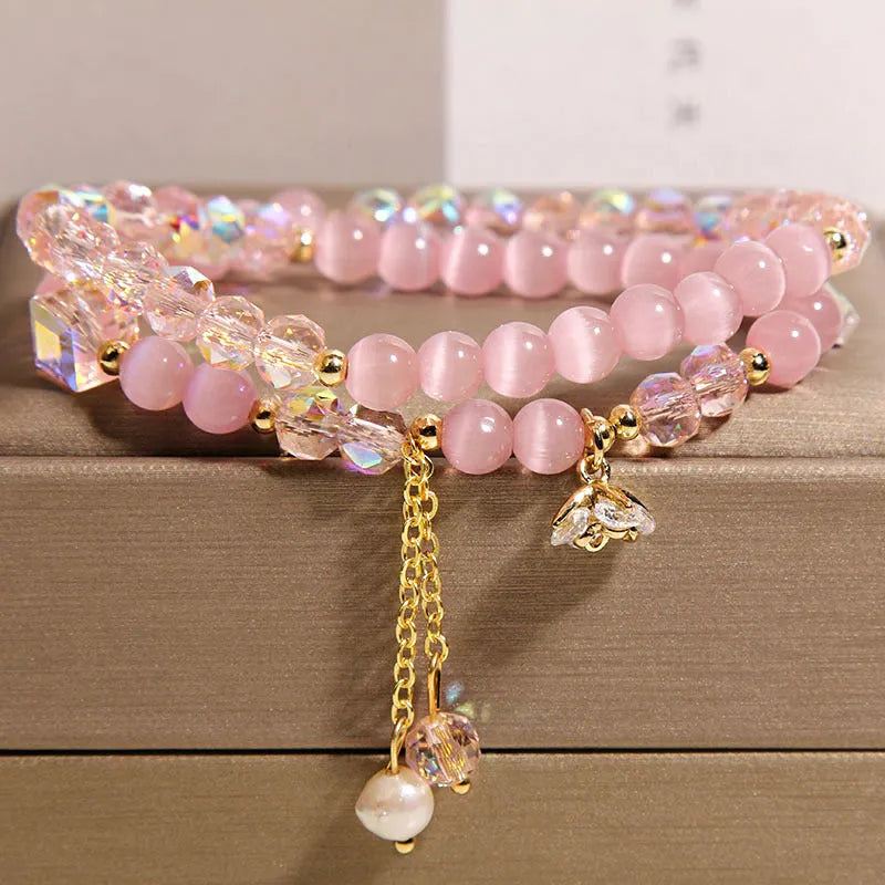 New Chinese style gold-plated double ring bracelet with pink cat eye crystal and zircon small flower detail
