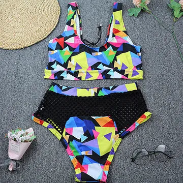 Women's checkered multicolour bikini set with cross-strap fishnet top and high-waist briefs.