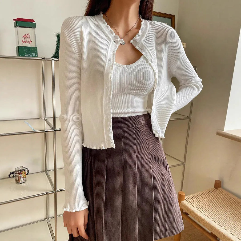 Women's white solid colour stringy selvedge cardigan with ruffled long sleeves, short length, open front design.
