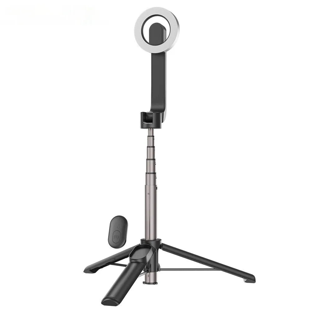 Magnetic mini selfie stick in black with Bluetooth remote and aluminium alloy tripod on a table