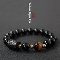 Handmade obsidian bracelet with 10mm yellow tiger eye beads in circular retro design