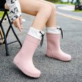 Women's solid colour PVC rain boots in apricot, shown in a size from the 36-40 range.