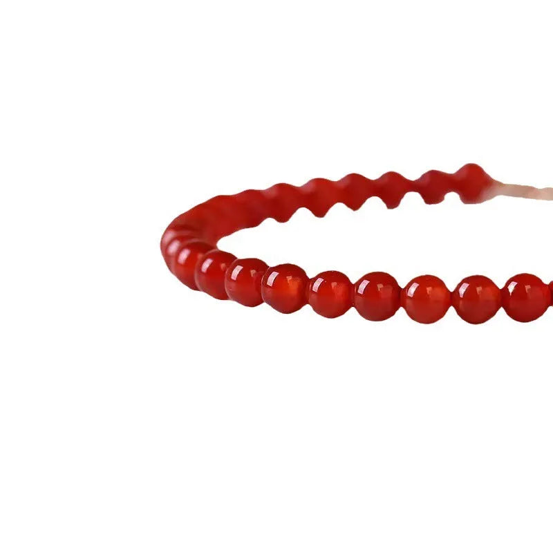 Ultra-thin classic red agate bracelet for women on a white background.