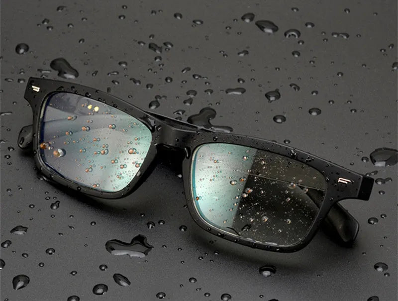 Smart glasses with a black PC+ABS frame featuring Bluetooth speakers and UV400 protective lenses.