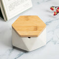 Ceramic ashtray with lid, Nordic style, available in multiple colours, on a tabletop