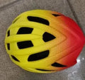ZH*002 orange In-Mold cycling helmet for road and mountain biking, showing 16 ventilation holes.