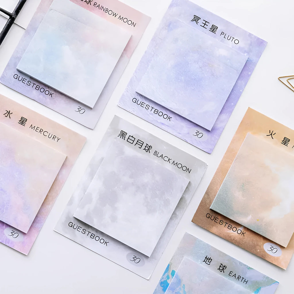Square planet-themed sticky note pad showing oil painting designs of moon, earth, and mars.