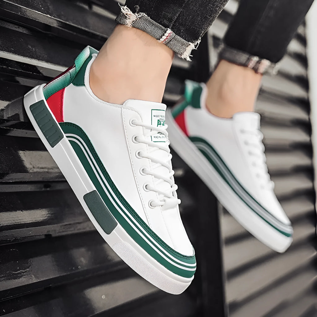 Men's beige, white and green canvas casual shoes with mesh panels and flat heel.