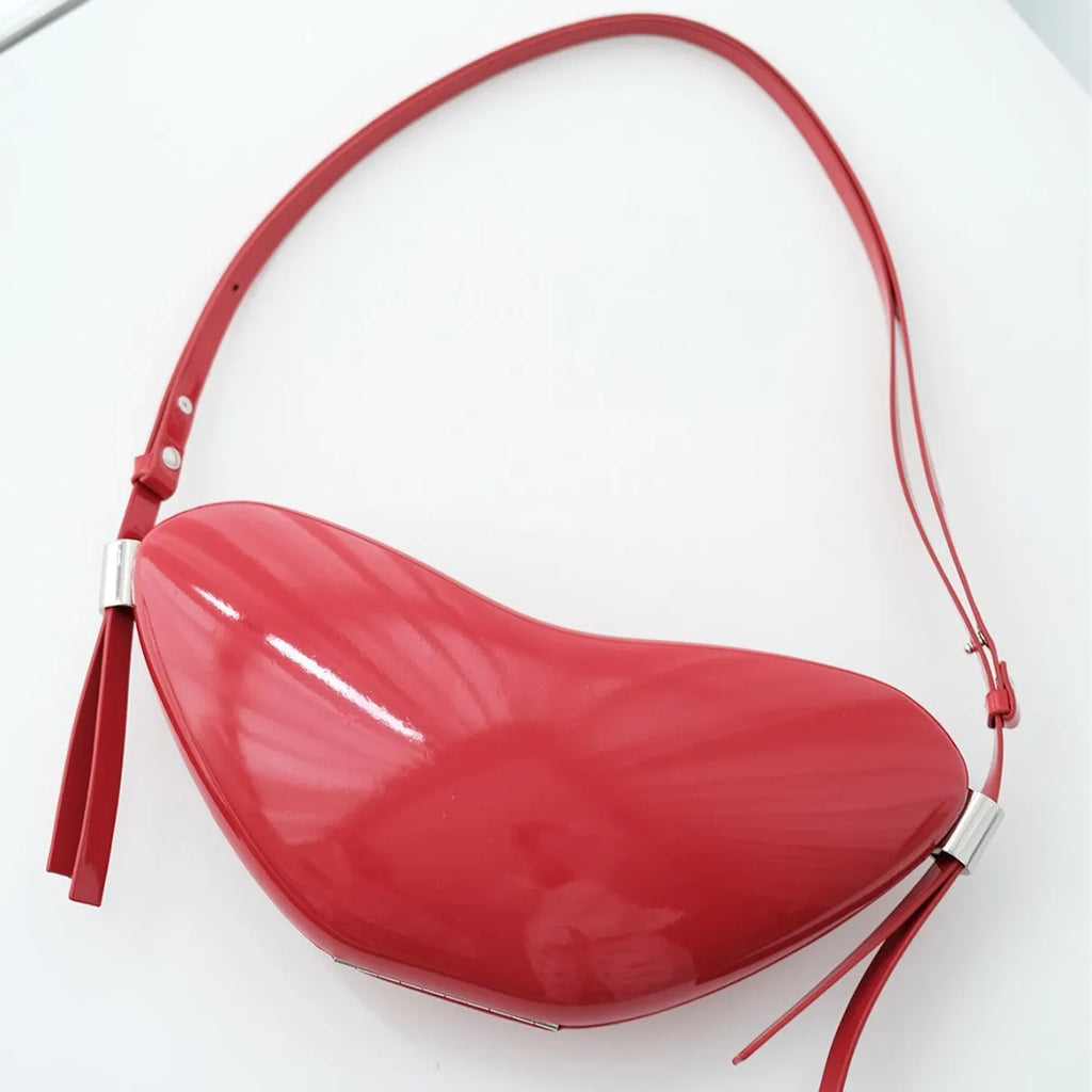 Red PU heart crossbody bag with single shoulder strap and sandwich pocket