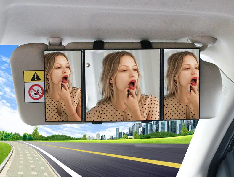 Silver folding car makeup mirror shown both closed and open on a car dashboard.