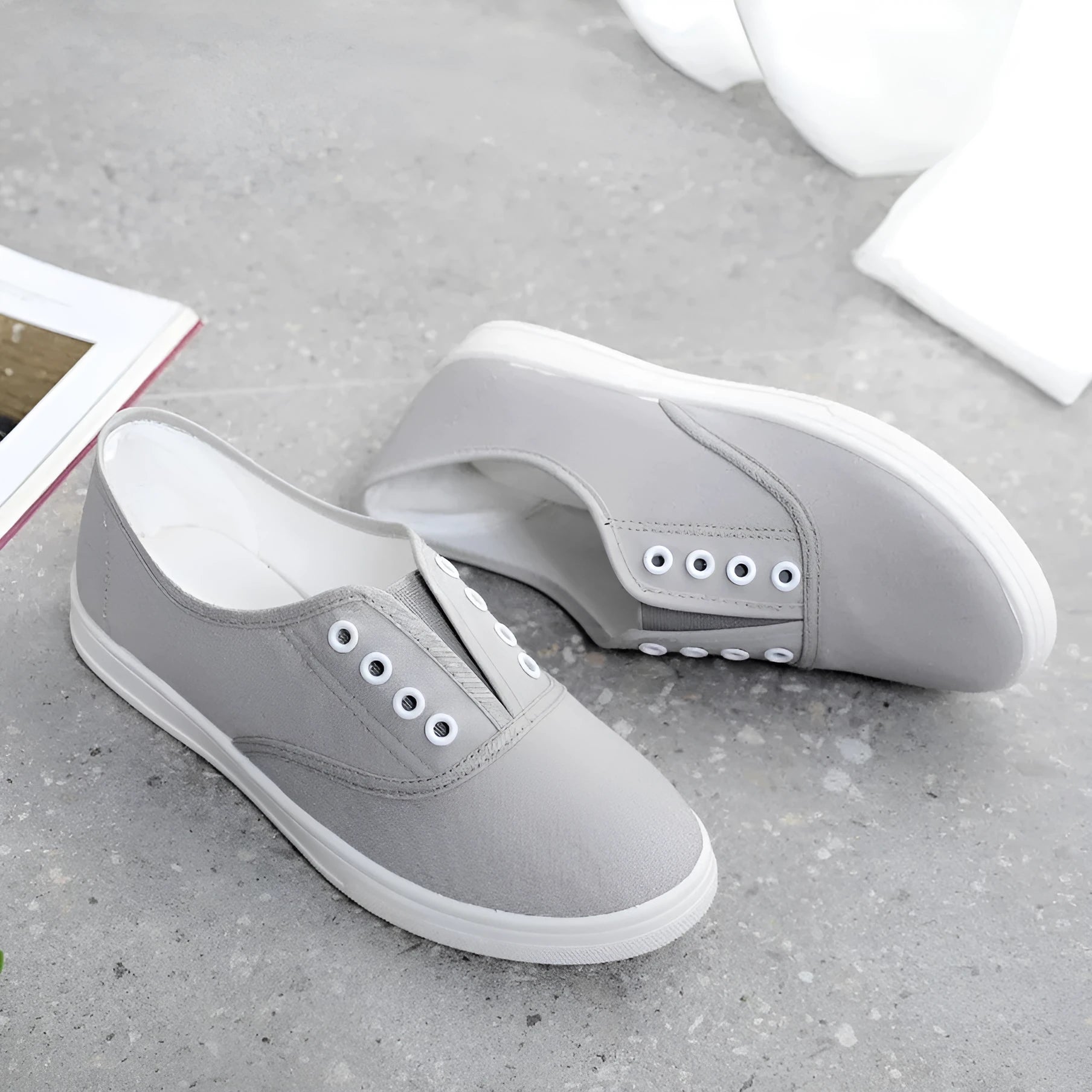 Low-top canvas casual shoes in black, grey, pink, and white colours with flat plastic soles
