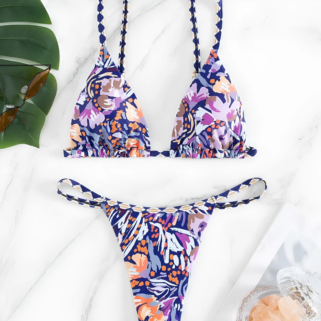 Women's floral print triangle top bikini swimsuit with briefs style bottoms in polyester fabric.