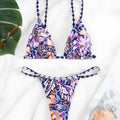 Women's floral print triangle top bikini swimsuit with briefs style bottoms in polyester fabric.