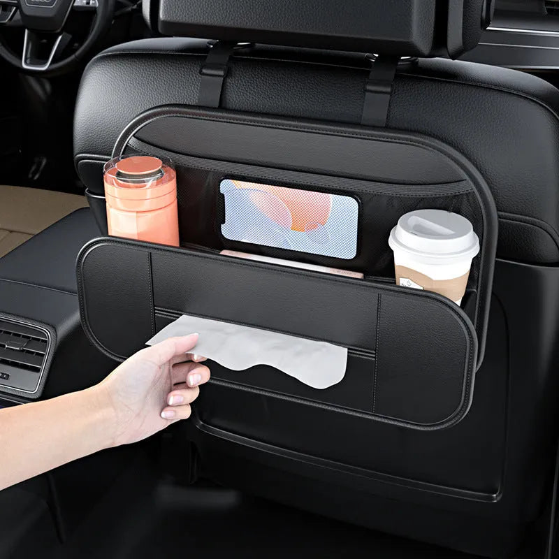 Black leather car seat storage bag with customisable compartments mounted on vehicle seatback