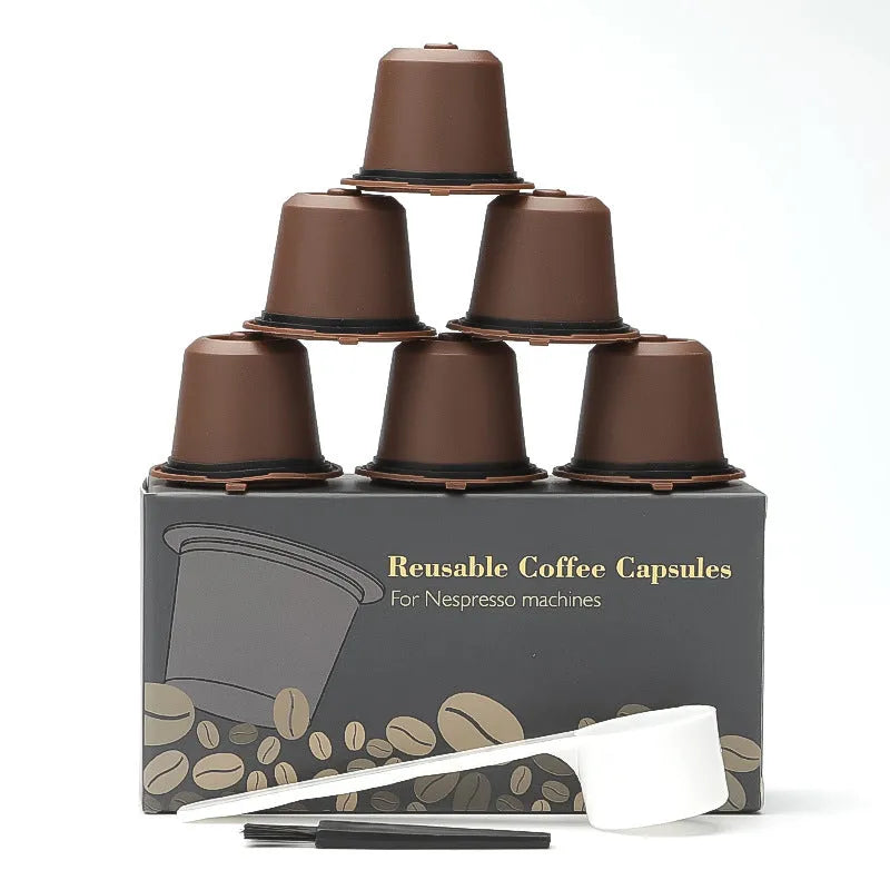 Six plastic coffee filter cups in black, red, and brown with a spoon, reusable shell capsule design for home brewing