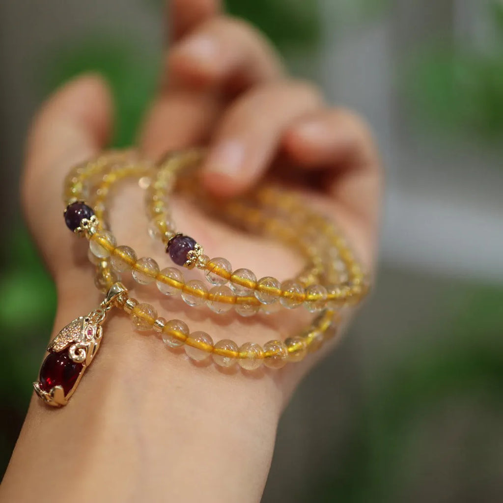 Natural Brazilian gold rutilated quartz bracelet with three-circle Chinese design and hanging chopsticks decoration