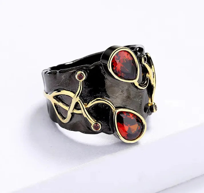 Women's black brass straight-pull oval ring on a neutral background