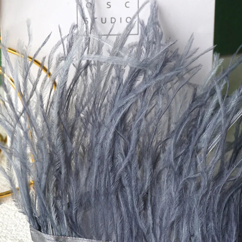 Decorative feather cloth strip in multiple colours including white, black, and mint green for DIY clothing and craft projects