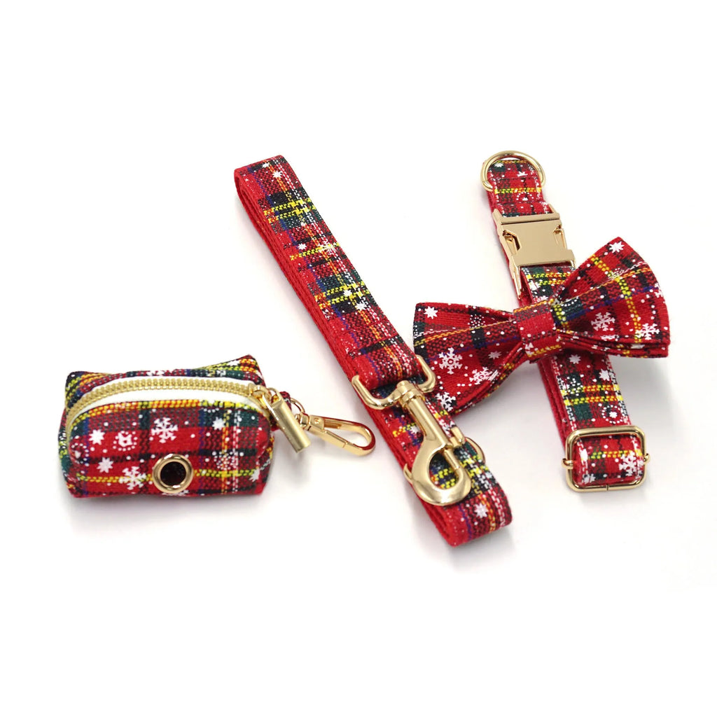 Red cloth Christmas dog collar and lead set with matching chest strap, bow, and waste bag.