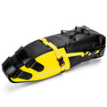 Yellow, black, and green 13-litre waterproof PVC bike tail bag mounted on a bicycle rear rack.