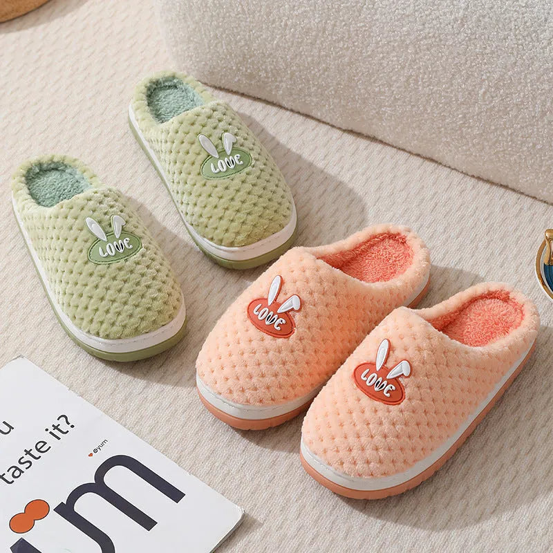 Rabbit plaid design women's plush slippers with anti-slip rubber soles in apricot colour.