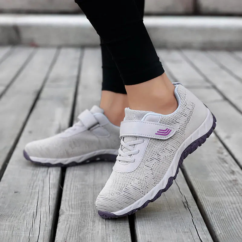 Women's grey purple low-top wedge heel shoes with Velcro strap and round toe.
