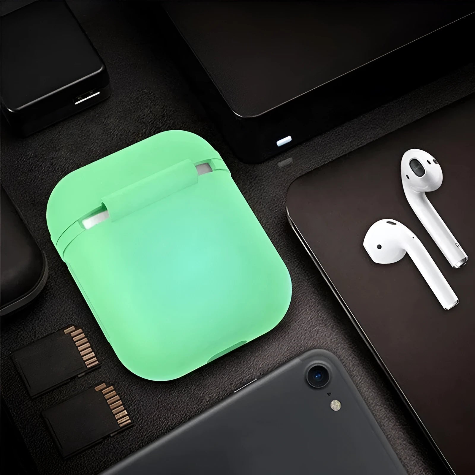 Glow-in-the-dark silicone flip-top protective case for Apple AirPods in a solid luminous colour.