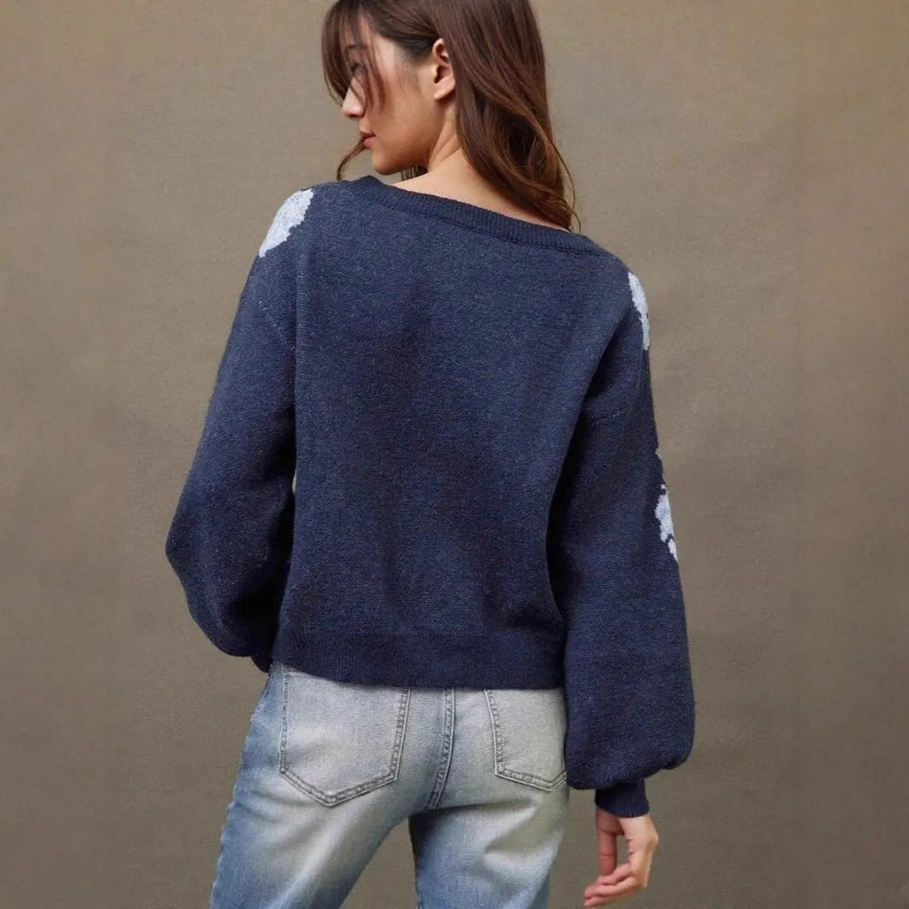 Sapphire blue women's pullover with a loose fit and an all-over floral jacquard pattern.