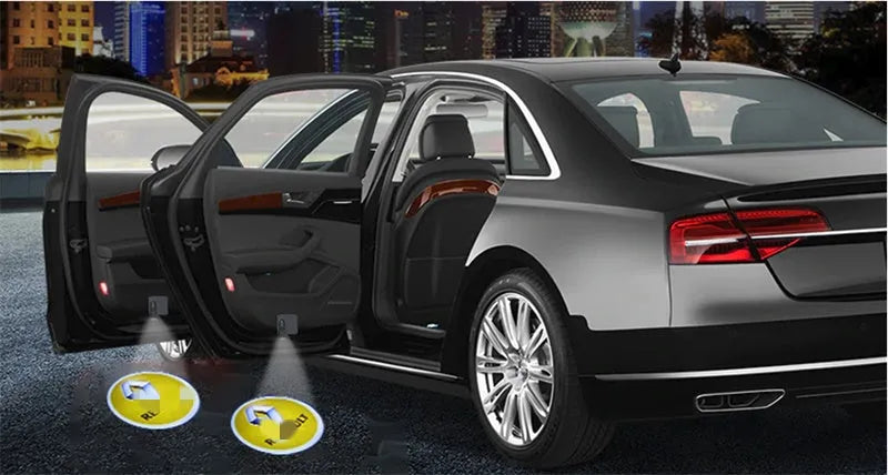 Two black wireless car LED welcome door projection lights with 3D logo display, plastic housing