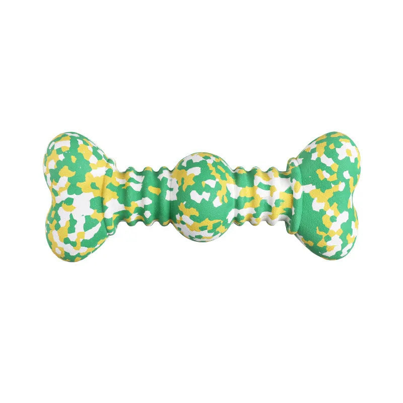 Green and white camouflage patterned natural rubber dog chew toy for large breeds on a wooden floor.