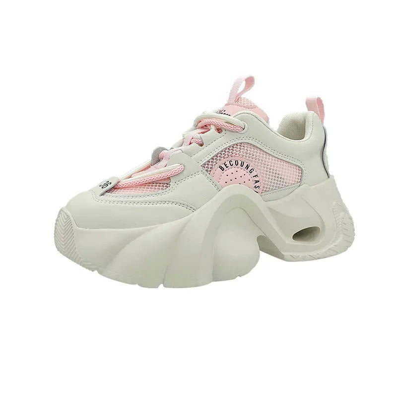 Women's beige casual sneakers with a cross strap and thick mid-heel sole.