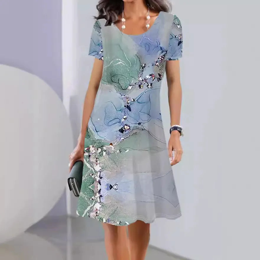 A woman's mid-length floral print summer dress with short sleeves and a round neck, shown in Element 3 colour.