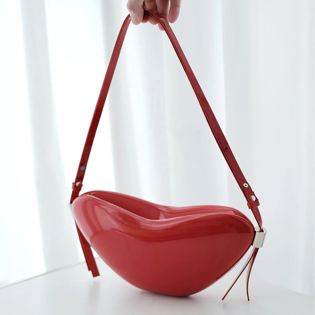Red PU heart crossbody bag with single shoulder strap and sandwich pocket