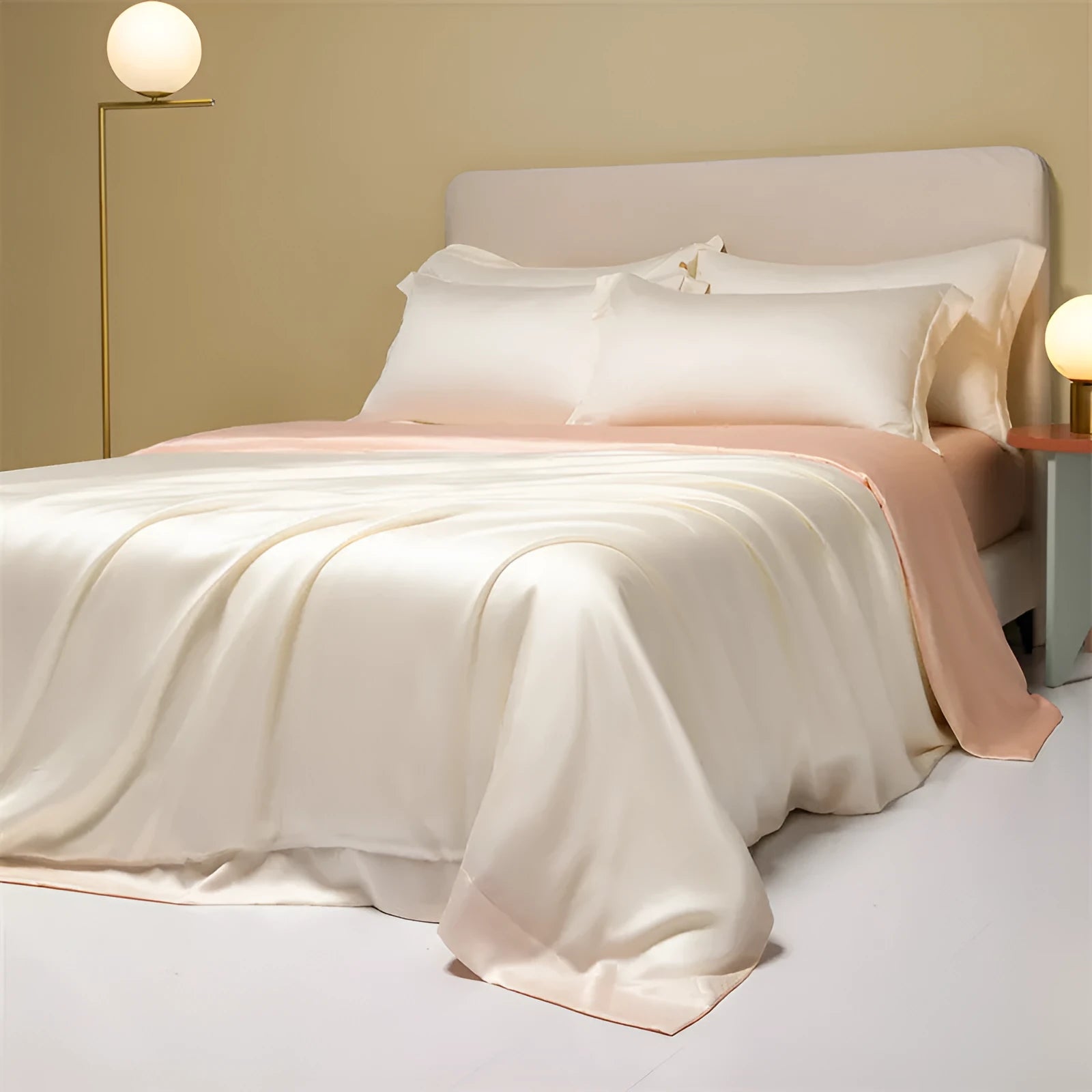 Luxury Tencel quilt cover and sheet set in Aurora Blue laid on a bed, showing deep pocket fitted sheet corner.