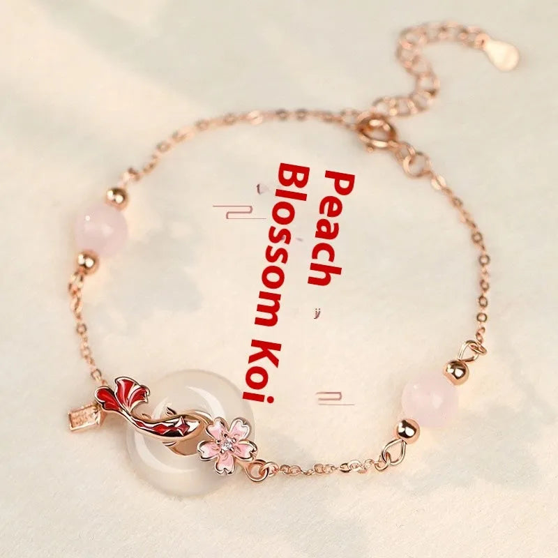 S925 sterling silver bracelet with Chinese flower design and white chalcedony crystal accents featuring koi fish motif