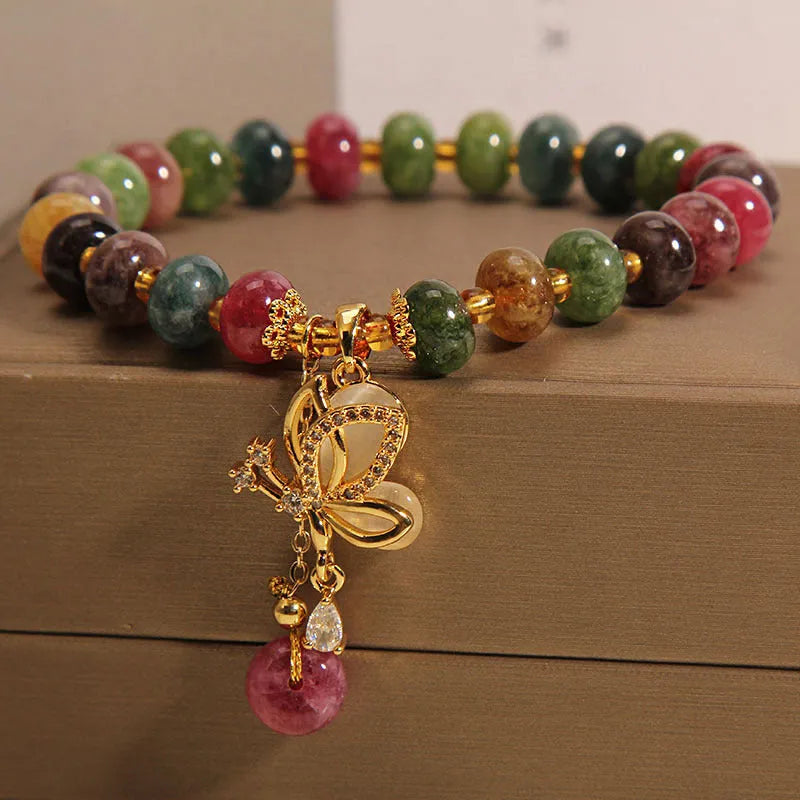 Colourful bead bracelet with alloy butterfly charm for women showing adjustable length