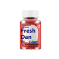 A fresh red plastic bottle containing grass green particle fishing bait for crucian carp.