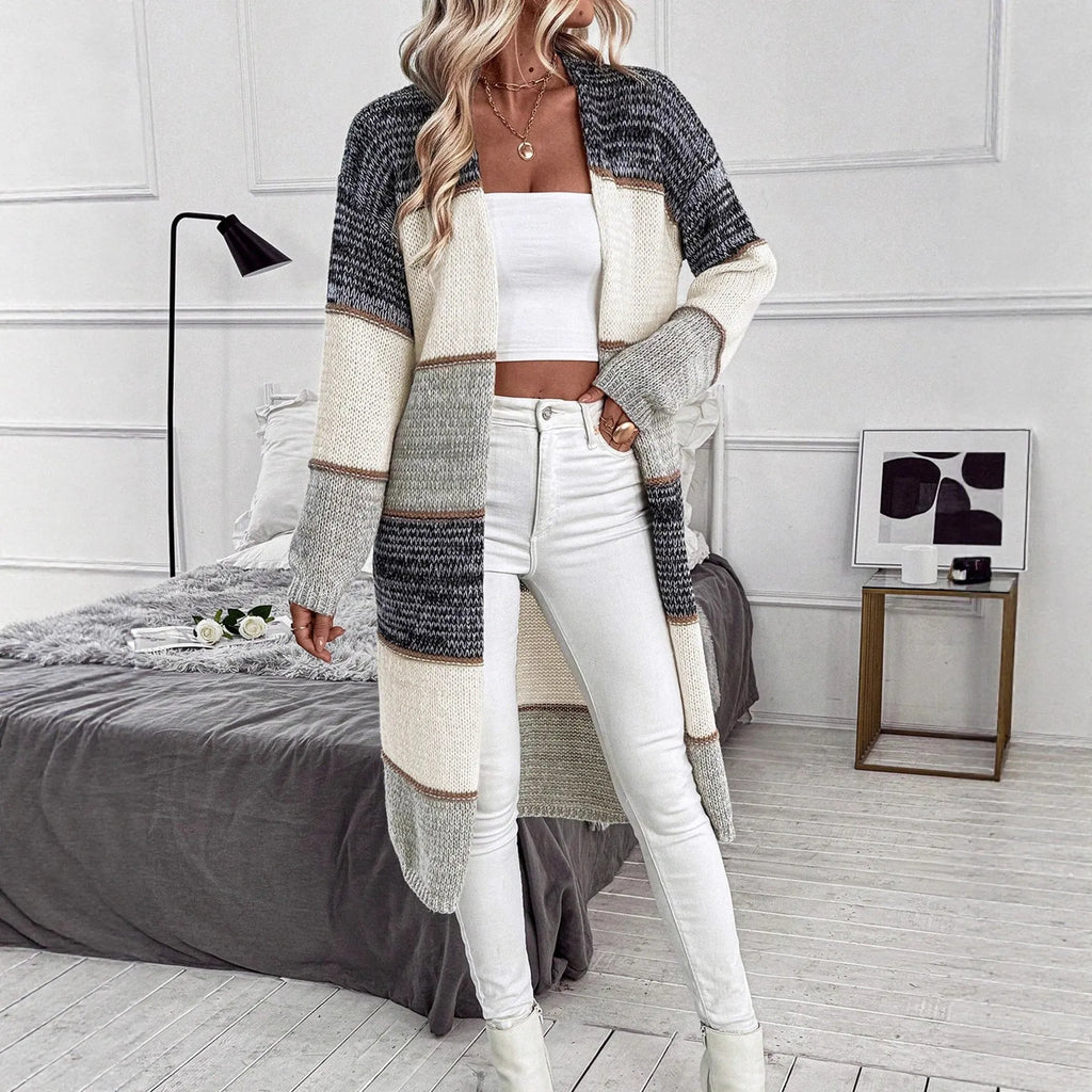 Grey striped knitted cardigan with long sleeves and loose fit street fashion style