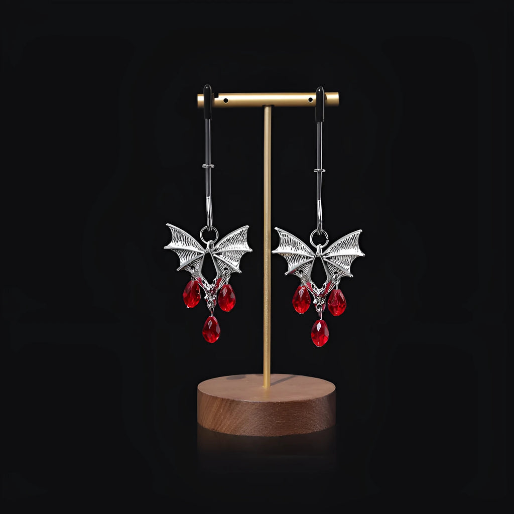 Silver alloy bat nipple clamp with adjustable tension and ruby detailing