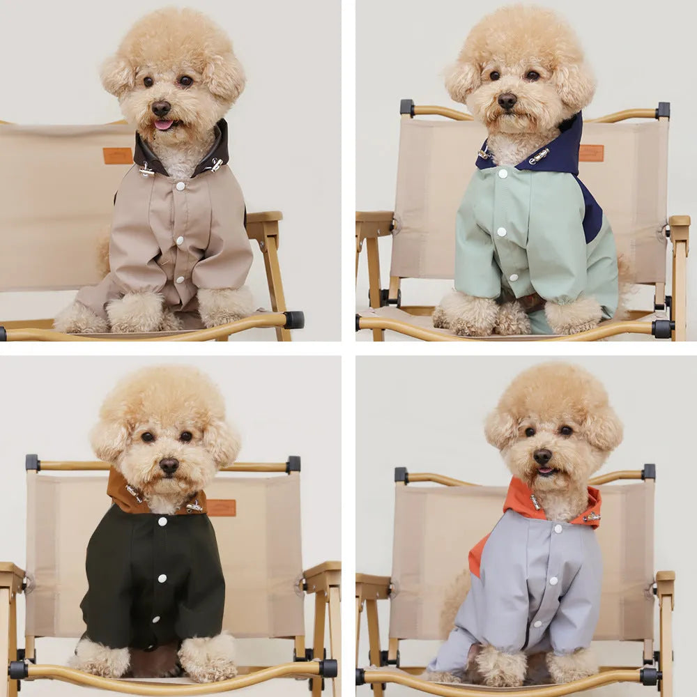 Khaki coloured waterproof shell jacket for a small dog, fastened with three white plastic snaps on the chest.