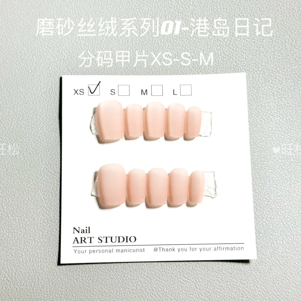 Frosted Velvet Cat's Eye press-on nails in short ladder sizes, showing solid colour and aurora designs.