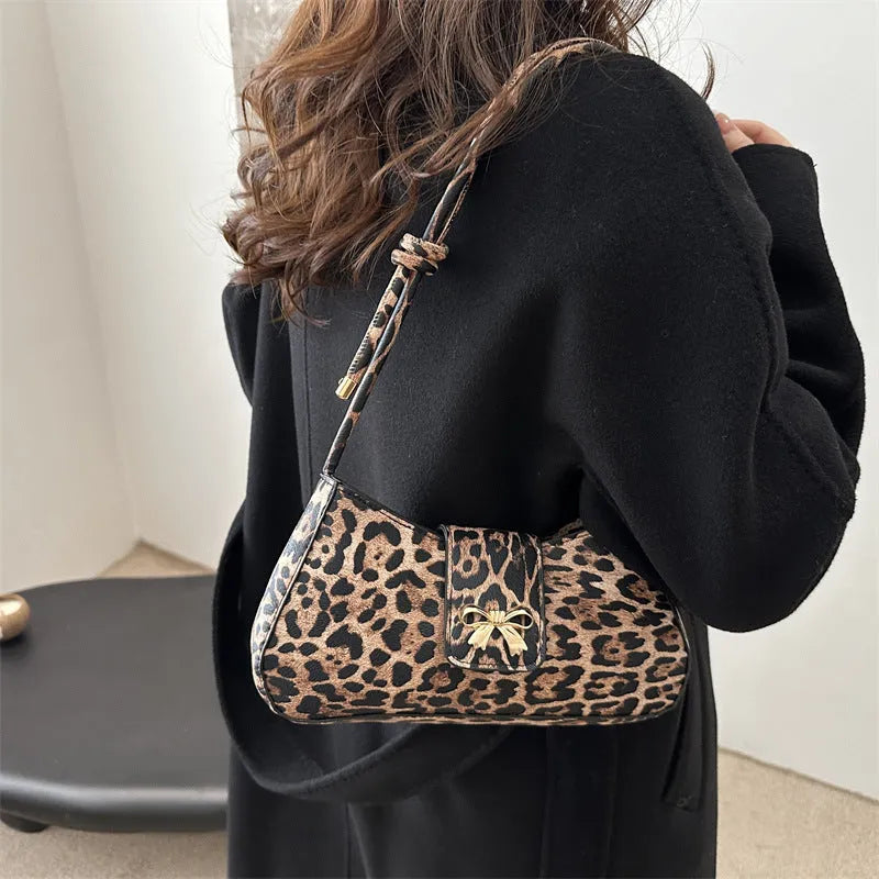 Women's casual PU leather handbag with sandwich pockets in brown colour showing 27cm length