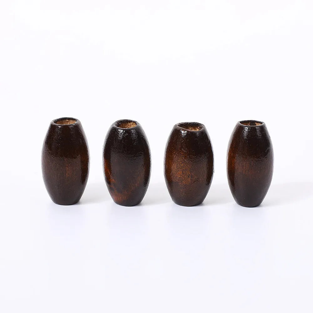 Dark coffee coloured oval wooden beads with M-shaped raised texture, 25mm size