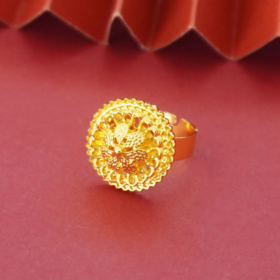 Gold-plated three-piece jewellery set with Middle Eastern flower design, showing necklace, pendant earrings, and ring.