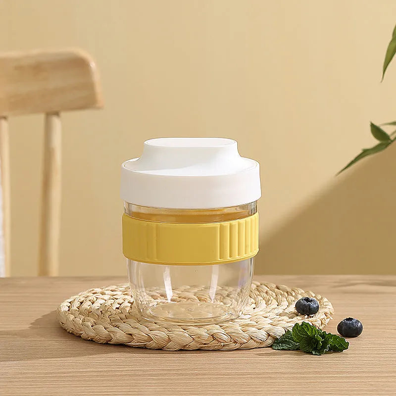 Green microwave-safe plastic salad cup with white lid and spoon, showing leak-proof seal.
